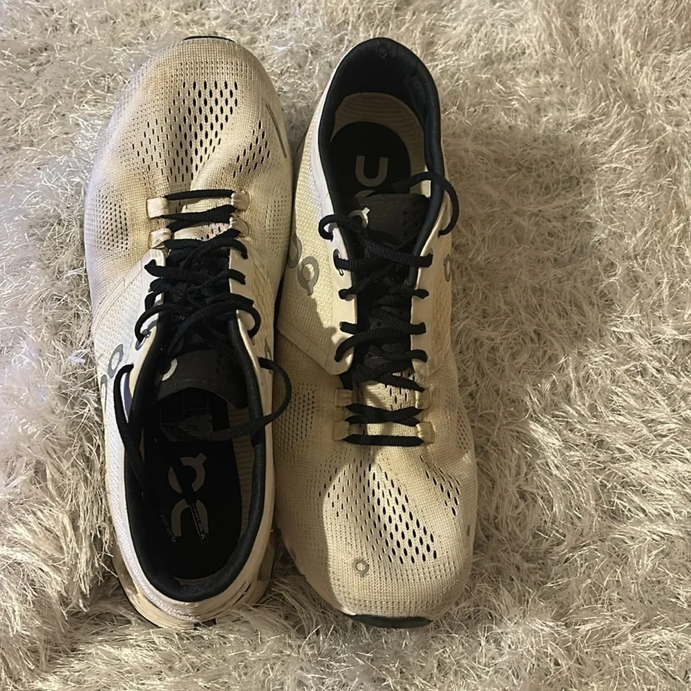 On Running Black and Cream Athletic Shoes
